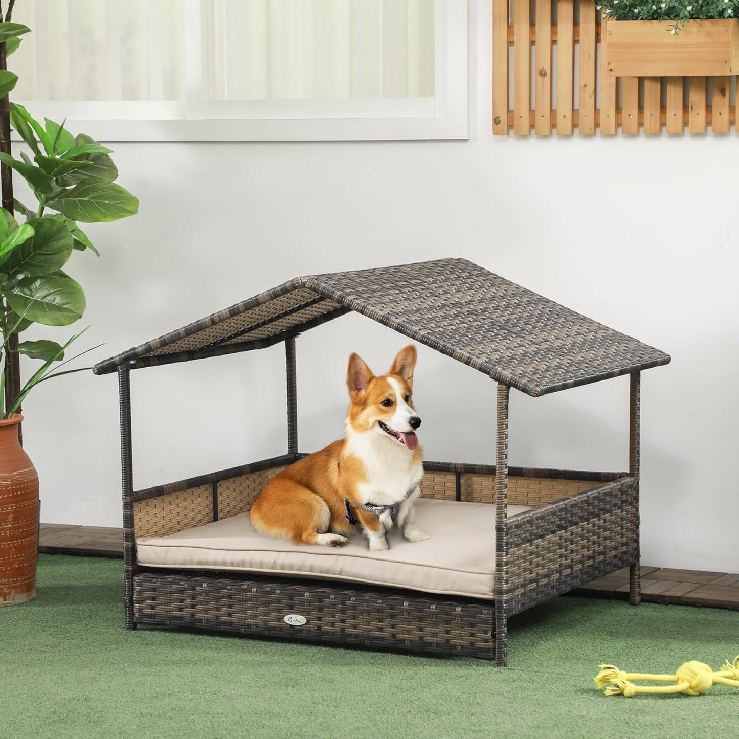 PawHut Wicker Dog House Outdoor with Canopy, Rattan Dog Bed with Water-Resistant Cushion, Raised Dog Bed for Small, Medium Dogs up to 66 lbs, 19.75" in Length, Brown Wicker, Khaki Cushion
